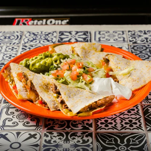 Fajita Quesadilla - Grilled quesadilla loaded with fajita meat and cheese